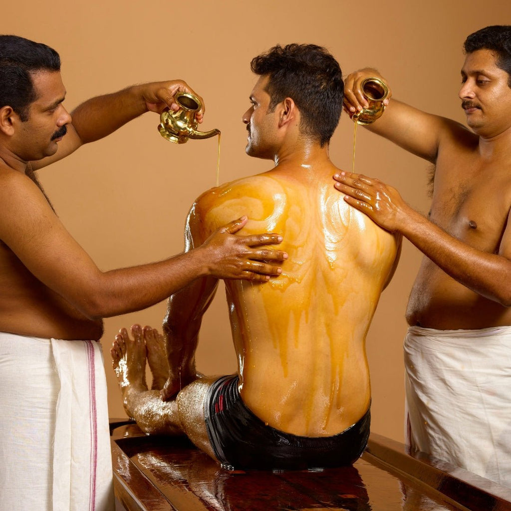 2 men providing Ayurveda treatment 